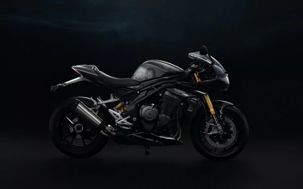 Triumph Speed Triple 1200 RR Bond Edition motorcycle displayed against a dark background, showcasing its sleek design and powerful features in a high-definition wallpaper.