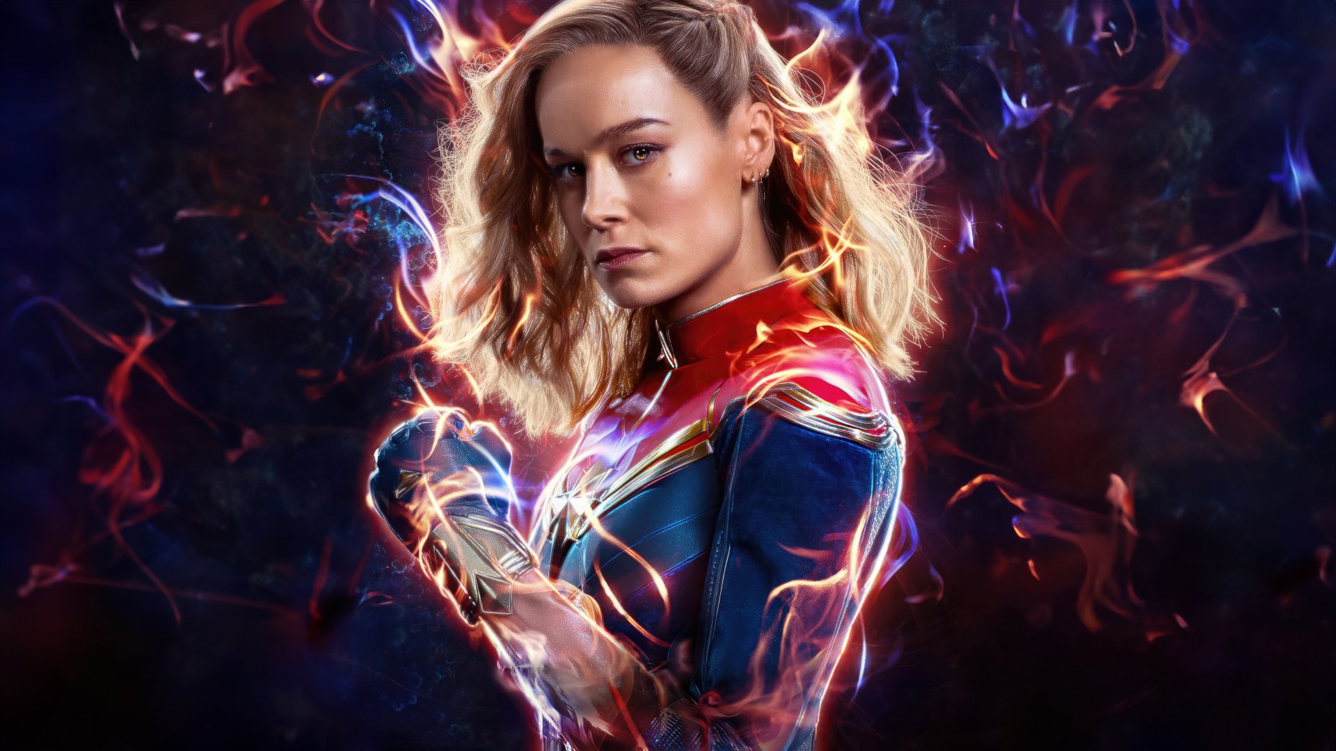 HD desktop wallpaper featuring a character from The Marvels movie, showcasing a powerful superhero with a glowing suit and intense expression amidst a dynamic, colorful background.