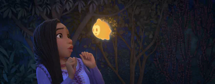HD wallpaper of an animated girl gazing in wonder at a glowing star-like creature in a magical forest, from Wish 2023 for desktop backgrounds.