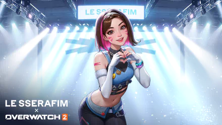 HD Overwatch 2 wallpaper featuring the character Kiriko forming a heart with her hands, set against a backdrop of vibrant stage lights.