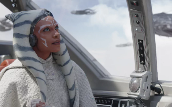 Ahsoka Tano gazes thoughtfully from the cockpit, surrounded by a futuristic landscape in this stunning HD wallpaper from the 2023 TV show, Ahsoka.