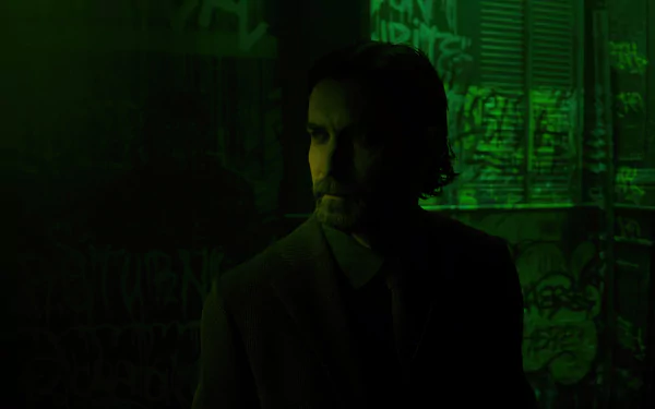 A dark and atmospheric HD wallpaper featuring a character from Alan Wake 2, standing in a shadowy environment illuminated by a green hue, evoking a sense of mystery.