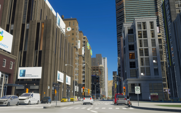 High-definition desktop wallpaper featuring a bustling urban avenue from the video game Cities: Skylines II, showcasing realistic cityscape graphics with vehicles and buildings along the street.