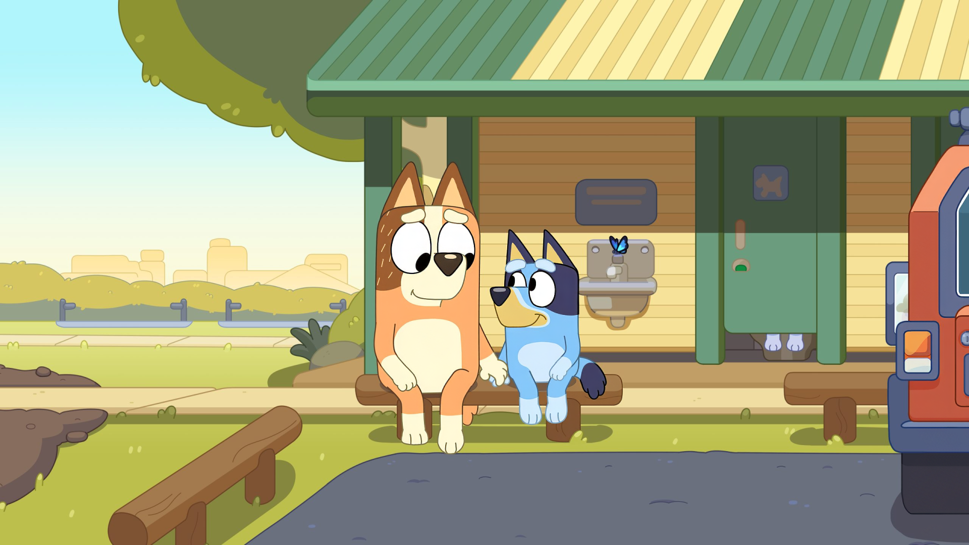 HD wallpaper featuring Bluey, the animated dog character, with another dog in front of a house on a sunny day for desktop background.