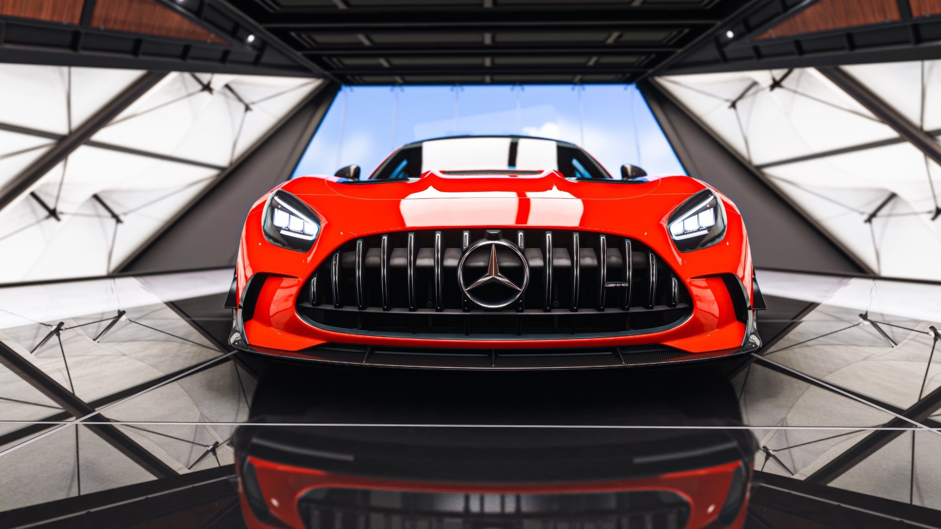 Front-on red Mercedes AMG sports car in a glossy showroom, reflected on the floor — Forza Horizon 5 video game 5K Ultra HD PC desktop wallpaper/background.