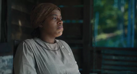 HD desktop wallpaper of a character from the 2023 movie The Color Purple, featuring a thoughtful expression in a vintage setting.