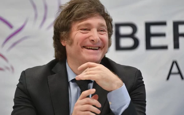 Smiling man in a suit with microphone for HD desktop wallpaper and background