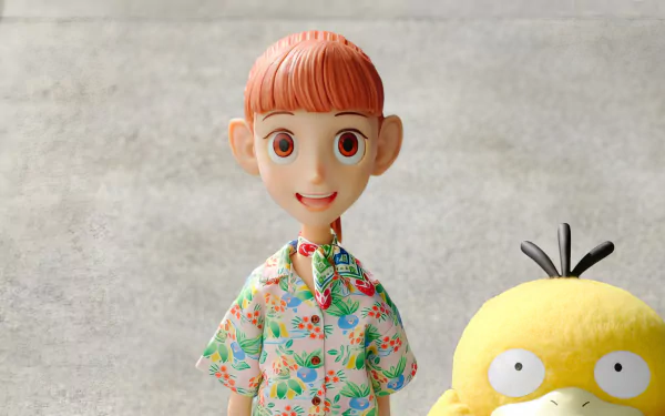 A vibrant HD wallpaper featuring a character from the Pokémon Concierge TV show, smiling alongside Psyduck, set against a textured background.