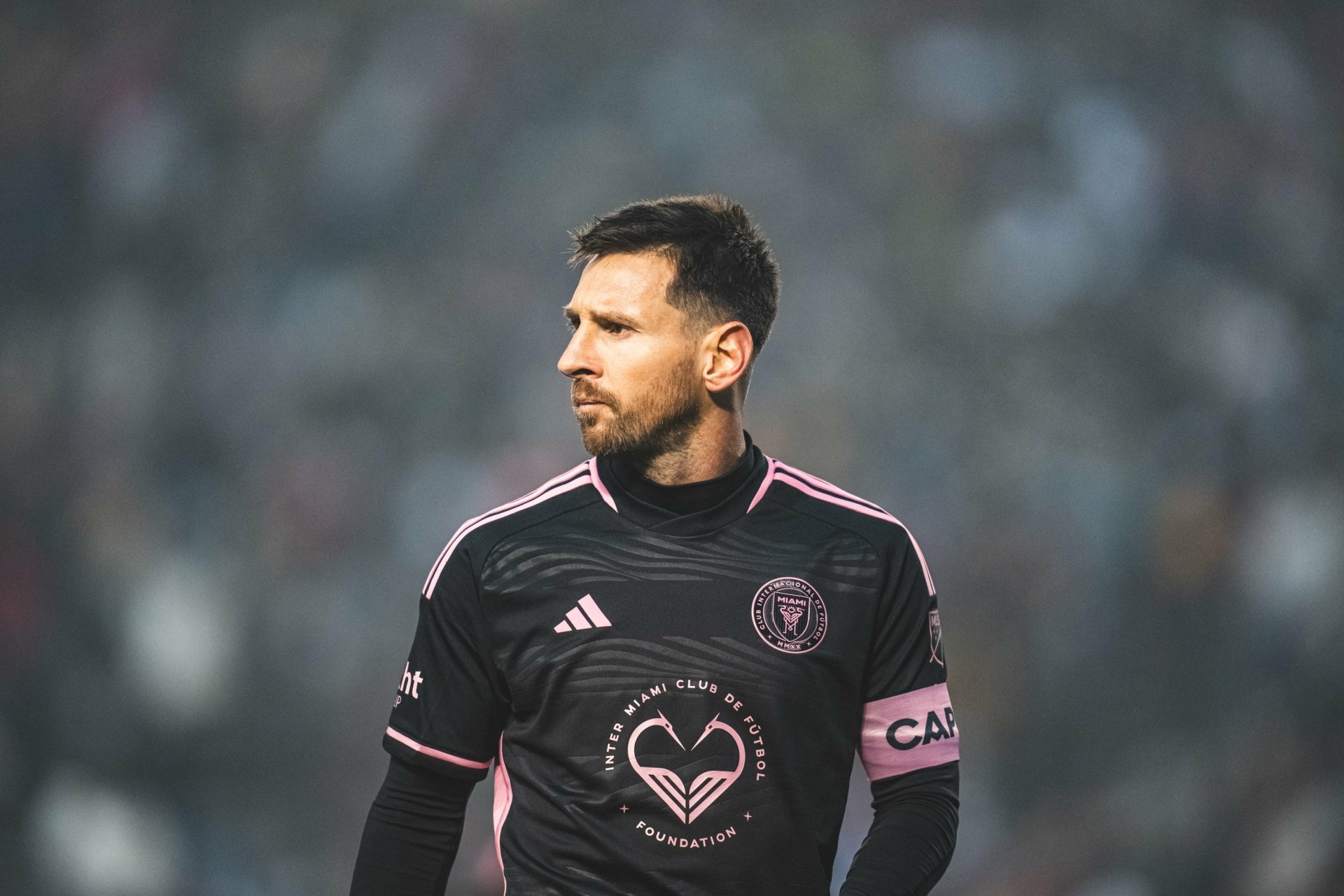 Lionel Messi in his Inter Miami CF jersey, showcasing his focus on the field. This high-definition image captures the excitement of soccer and the spirit of the sport.
