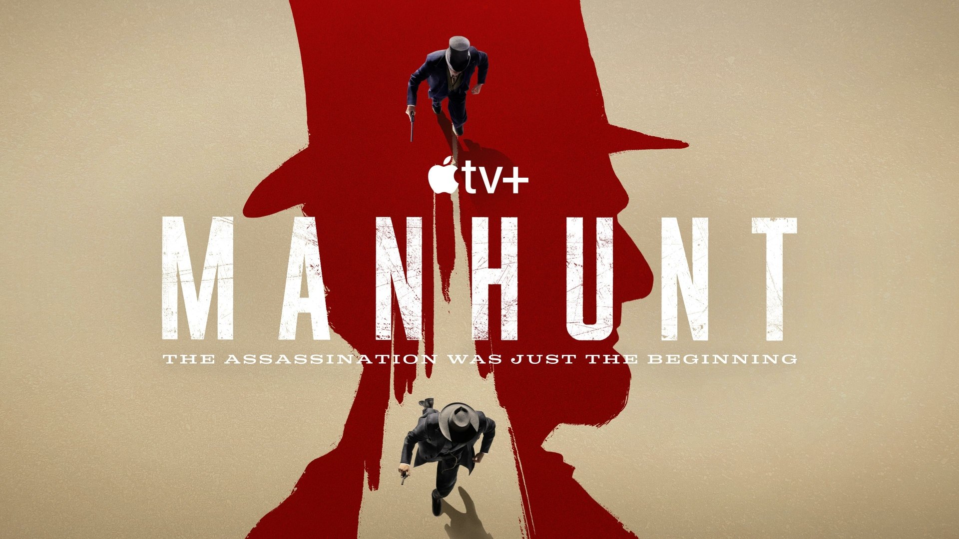 HD desktop wallpaper for the TV show Manhunt with a silhouette figure abseiling down a red backdrop featuring the show's title and the tagline The assassination was just the beginning from Apple TV+.