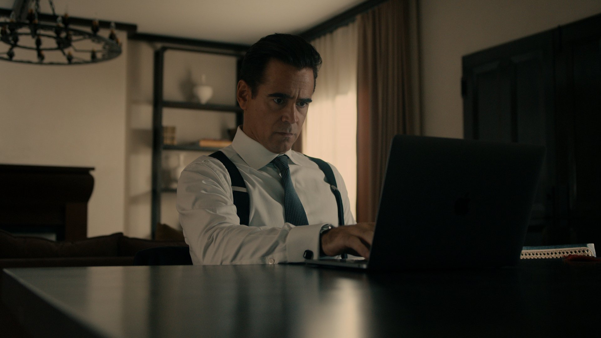 High-definition desktop wallpaper featuring a dramatic scene from the TV show 'Sugar' with a focused character in a business setting working on a laptop.