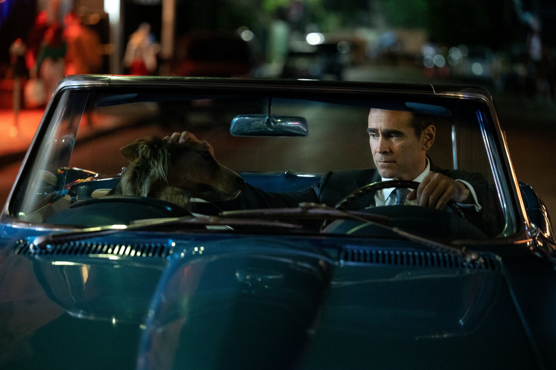 HD wallpaper of a scene from the 2024 TV show Sugar featuring a character portrayed by actor Colin Farrell driving a car at night.