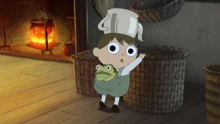 HD desktop wallpaper featuring characters from Over the Garden Wall, with a young boy in a chef's hat standing beside a frog in a cozy room with a fireplace.