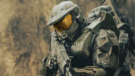 HD desktop wallpaper featuring a character from the TV show Halo in full armor, focused and ready for action.
