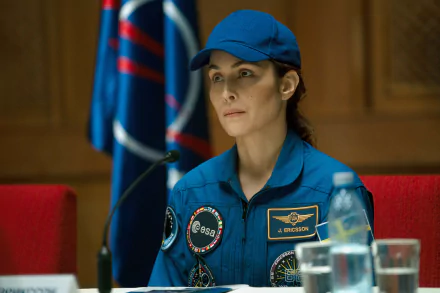 Actress in a blue ESA spacesuit portraying a character in the TV show 'Constellation' (2024), available as an HD desktop wallpaper and background.