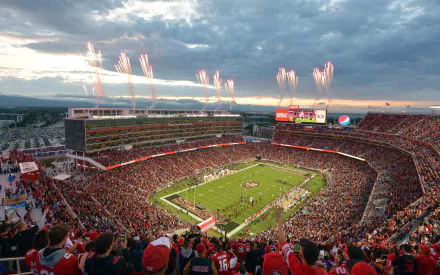HD wallpaper of a San Francisco 49ers NFL game with fireworks at the stadium filled with fans.