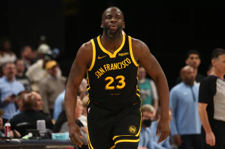 HD wallpaper of Golden State Warriors player wearing jersey number 23 in action on the basketball court.