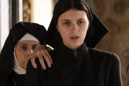 HD wallpaper from The First Omen featuring a nun placing her hand on a young woman's shoulder, evoking a sense of concern.