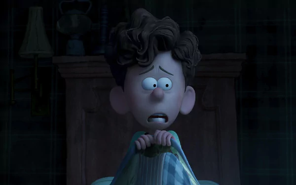 A young boy, frightened and wide-eyed, clutches his blanket in the dark, captured in a scene from the movie Orion and the Dark. This image serves as a striking HD wallpaper background.