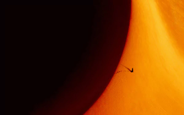 Dune: Part Two HD desktop wallpaper featuring a cinematic desert scene with an isolated figure amidst vast orange dunes.