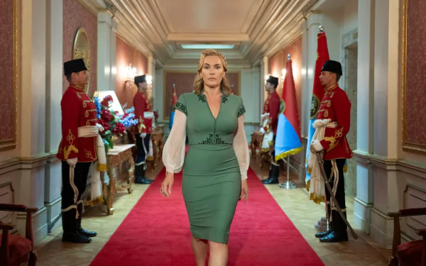 Kate Winslet walking down a red carpet in a scene from The Regime TV show, available as an HD desktop wallpaper.