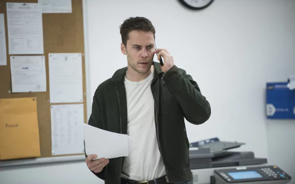 Actor from TV show True Detective, portraying a focused character on a phone call in an office setting, in a high-definition wallpaper background.