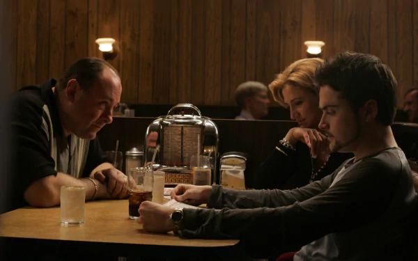 HD wallpaper featuring characters from The Sopranos TV show having a conversation at a diner table, evoking the iconic style of the series.