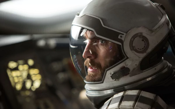 Close-up of an astronaut from the movie Interstellar, wearing a helmet, with a serious expression, perfect as a high-definition desktop wallpaper and background.