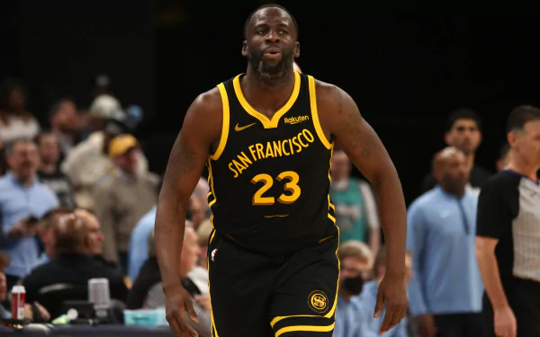 HD wallpaper of Golden State Warriors player wearing jersey number 23 in action on the basketball court.