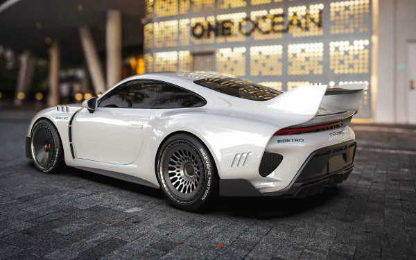 A white Rezvani Retro RR1 car parked in front of a building with ONE OCEAN signage, serving as an HD desktop wallpaper.