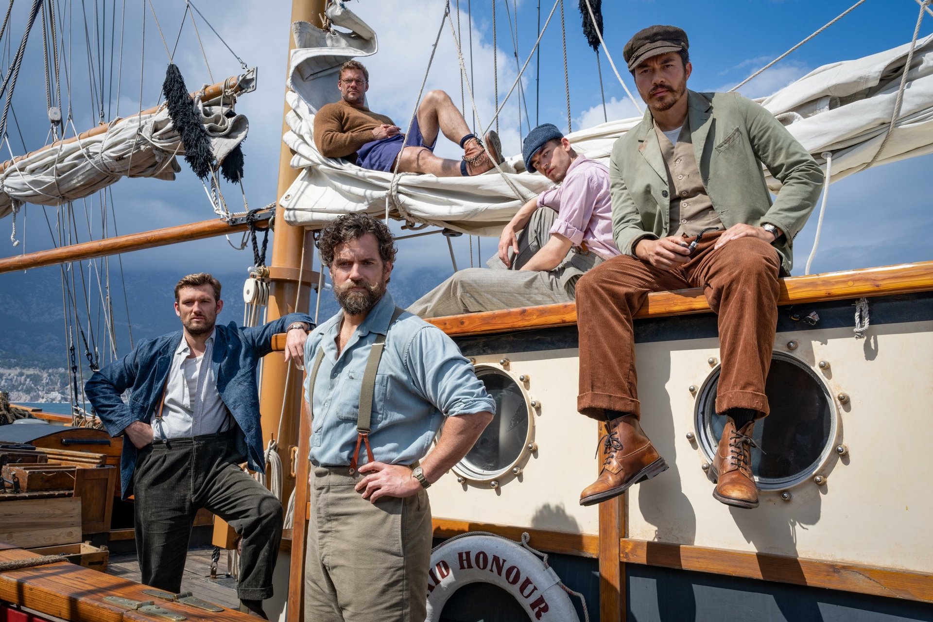 HD desktop wallpaper featuring characters from The Ministry of Ungentlemanly Warfare movie posed on a sailboat.