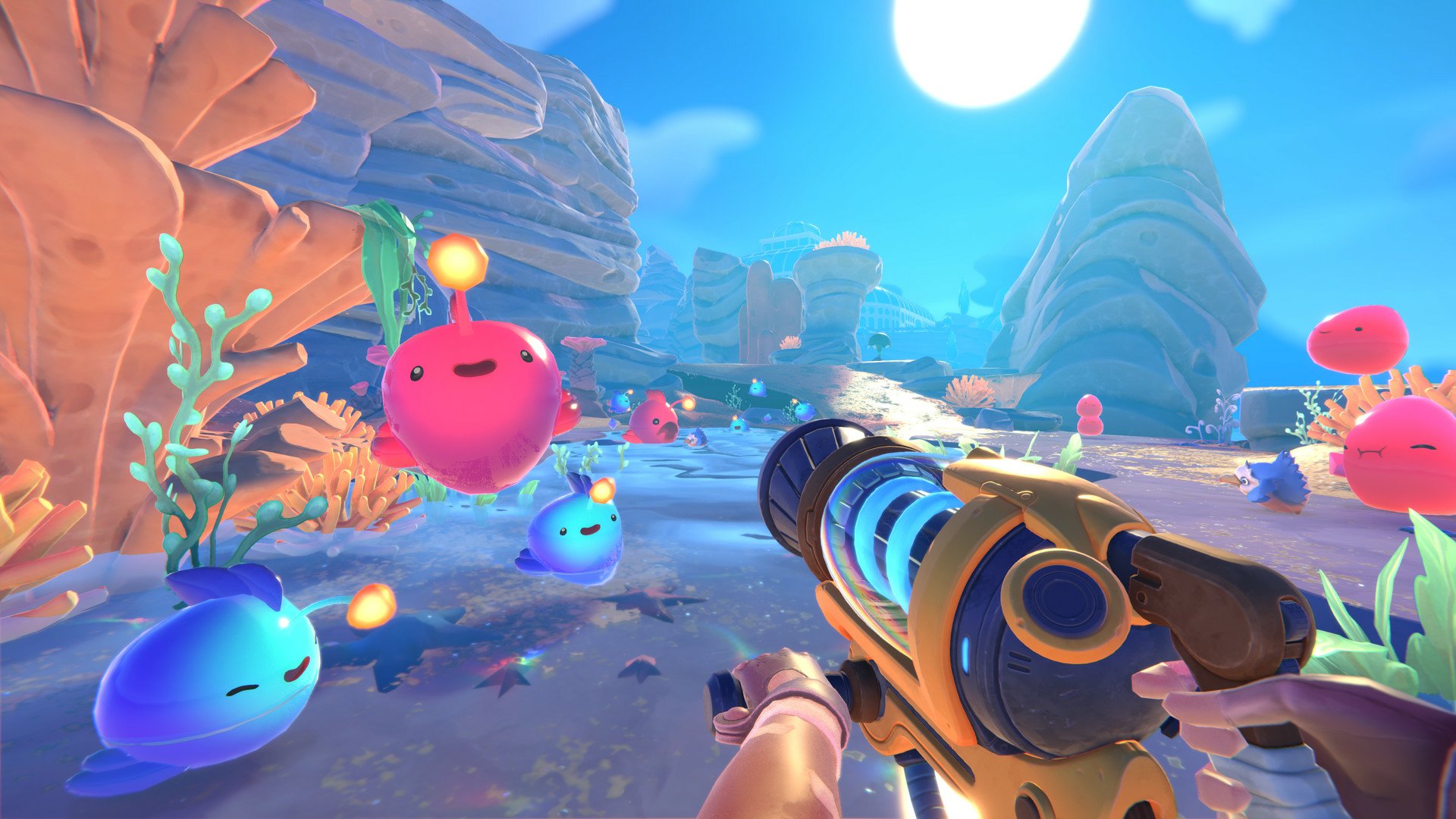 HD desktop wallpaper from Slime Rancher 2 featuring a colorful scene with lively slimes and a handheld vacuum in a whimsical alien landscape.