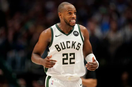HD desktop wallpaper featuring Khris Middleton of the Milwaukee Bucks in action on the basketball court, wearing his white Bucks jersey.