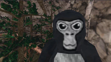 HD desktop wallpaper of a character from the video game Gorilla Tag, depicted as a gorilla with a mask standing in a forest environment.