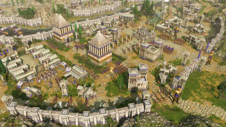 HD desktop wallpaper from the video game Age of Mythology: Retold, showcasing an intricately detailed ancient city with majestic architecture and bustling activity.