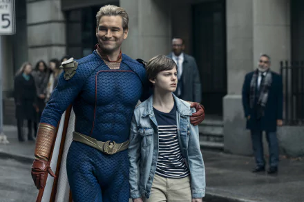 HD desktop wallpaper featuring Homelander, portrayed by Antony Starr, from the TV show The Boys (2019), with his arm around a young boy on a city street. Urban background with pedestrians.