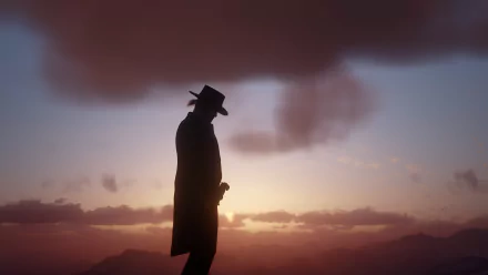 Silhouette of Arthur Morgan from Red Dead Redemption 2 against a glowing sunset — 4K Ultra HD PC desktop wallpaper.
