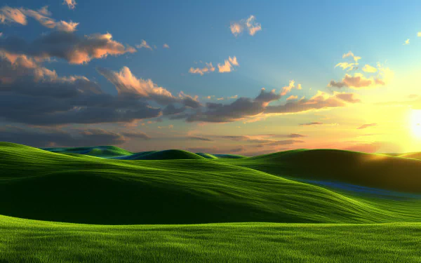 HD desktop wallpaper featuring a vivid Windows XP-style landscape with rolling green hills and a vibrant sunset sky.