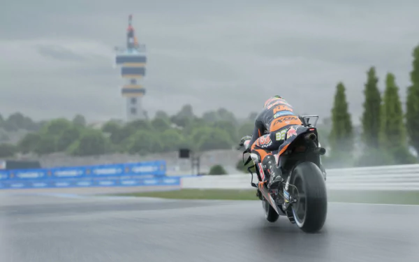 HD desktop wallpaper featuring a MotoGP 24 motorcycle racing on a wet track, with spray from the tires and a tower in the background.
