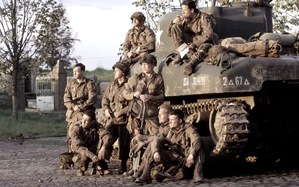 A HD desktop wallpaper from the TV show Band of Brothers, depicting soldiers in WWII uniforms posing around a tank.