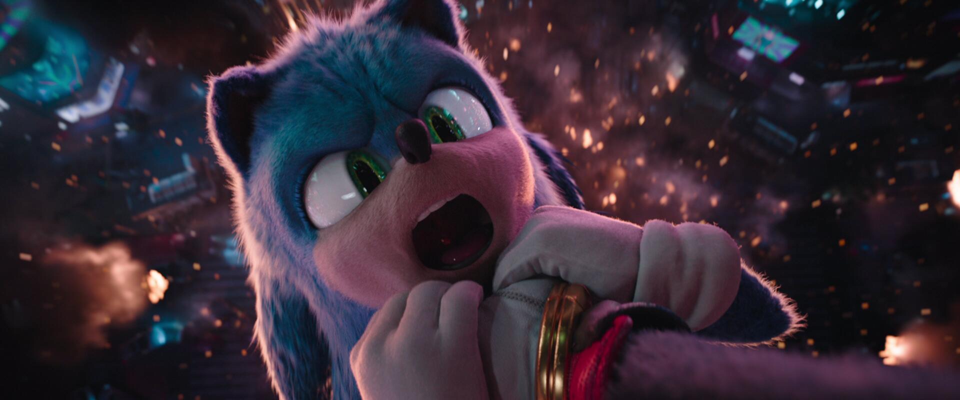 HD PC desktop wallpaper featuring Sonic the Hedgehog from Sonic the Hedgehog 3, showcasing a close-up of Sonic gripping a golden ring amidst dynamic lighting effects.