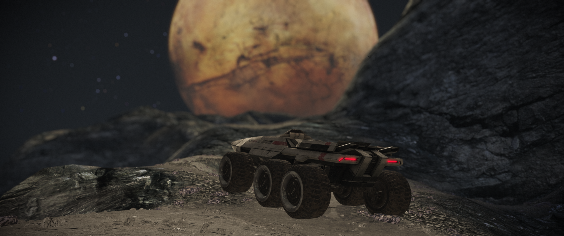 A stunning HD wallpaper from the video game Mass Effect, featuring a vehicle exploring a rugged landscape under a large, distant planet.