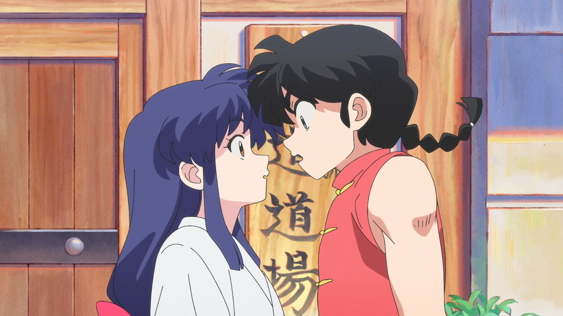 HD anime desktop wallpaper featuring Ranma Saotome and Akane Tendou from Ranma ½ in a close, intense moment inside a traditional dojo setting.