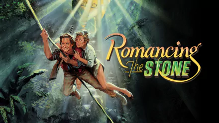 Romancing the Stone HD PC desktop wallpaper: two adventurers swing on a vine through a sunlit jungle, the movie logo displayed prominently to the right.