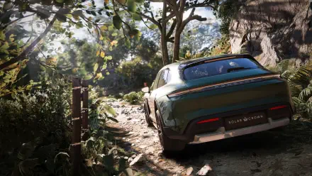 A stunning HD wallpaper from Test Drive Unlimited Solar Crown, showcasing a sleek car navigating a lush, green landscape surrounded by trees and rocks.