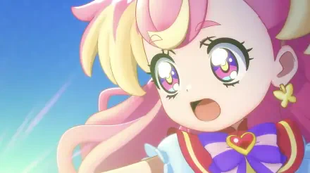 A vibrant scene from Wonderful Pretty Cure! The Movie!: A Thrilling Adventure In The Game World! featuring a joyful character with colorful hair and large, expressive eyes.