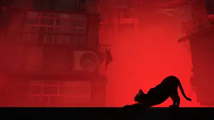 HD desktop wallpaper from Stray featuring the silhouette of a cat stretching against a vivid red, urban backdrop.