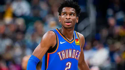 Shai Gilgeous-Alexander of the Oklahoma City Thunder is featured in this HD basketball wallpaper, capturing his focus during an NBA game.