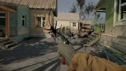 A gripping scene from the video game Into the Radius VR, showcasing a character holding a weapon against a backdrop of abandoned buildings and an old car, creating an atmospheric tension.