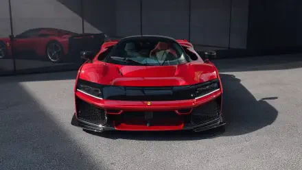 A stunning Ferrari F80 showcased in vibrant red, captured in 8K Ultra HD, featuring sleek lines and a dynamic design against a modern backdrop.